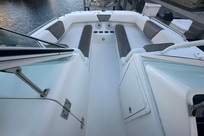 Slide: The Image of 2021 World Cat 230 SD boat interior with seating and storage compartments. - 31