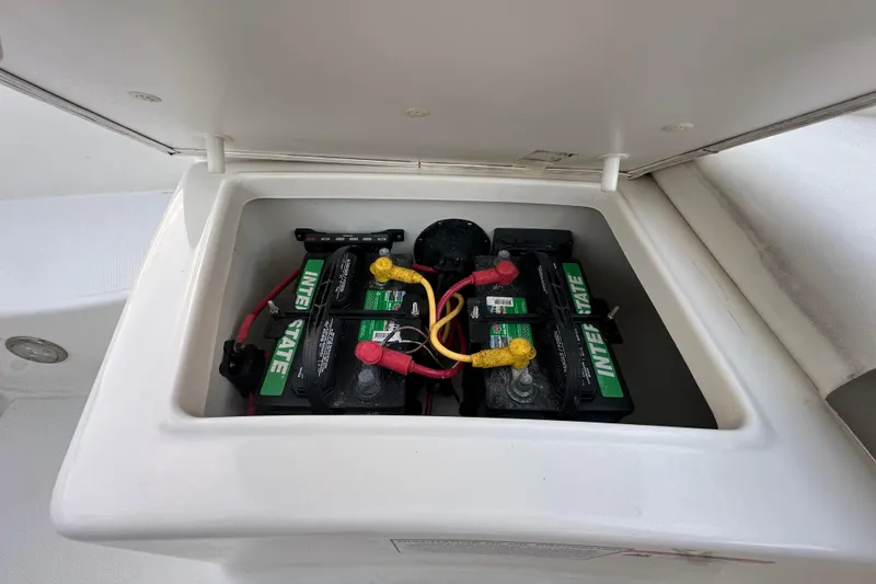 Slide: The Image of Battery compartment of 2021 World Cat 230 SD boat with Interstate batteries. - 85