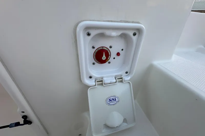 Slide: The Image of Battery switch compartment on a 2021 World Cat 230 SD boat. - 92