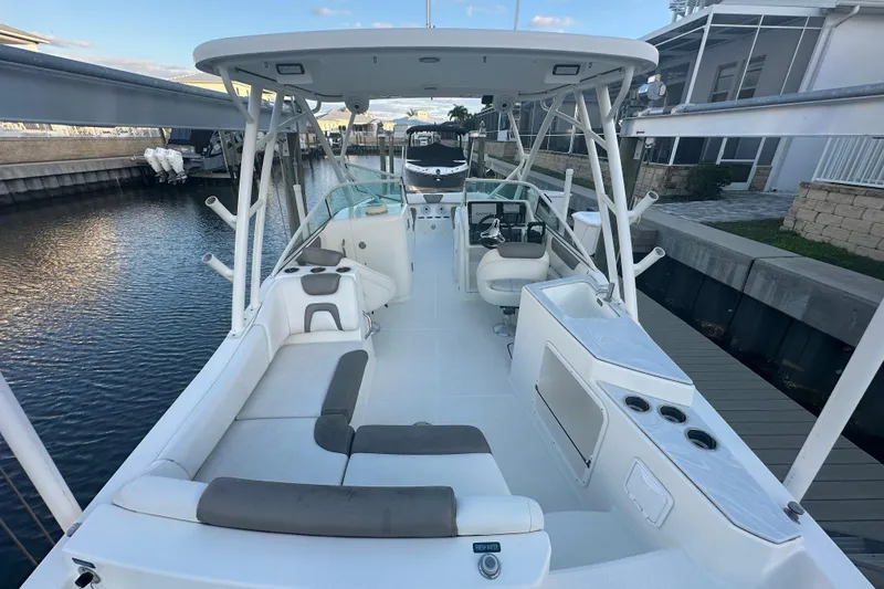 Slide: The Image of 2021 World Cat 230 SD boat interior, featuring spacious seating and modern amenities. - 10