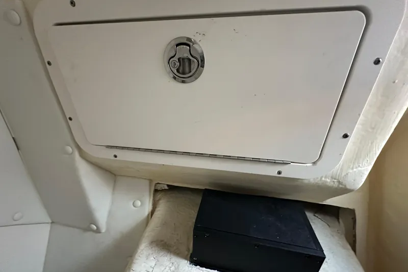 Slide: The Image of Storage compartment on a 2021 World Cat 230 SD boat interior. - 100