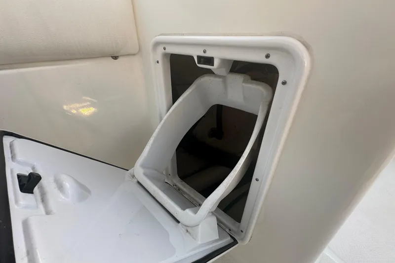 Slide: The Image of 2021 World Cat 230 SD boat storage compartment with open hatch. - 64