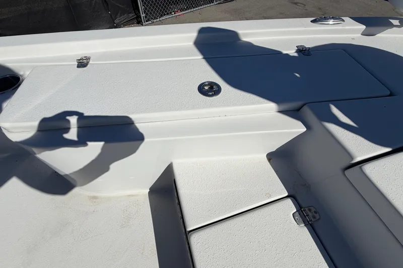 Slide: The Image of 2020 Blazer Bay 2200 Fisherman boat deck with storage compartments and shadows. - 35