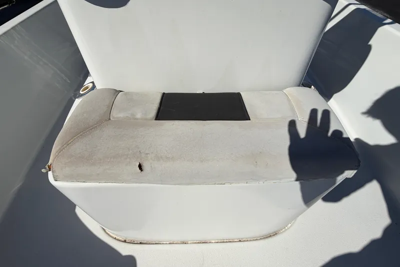 Slide: The Image of 2020 Blazer Bay 2200 Fisherman boat seat with visible wear and shadow. - 50