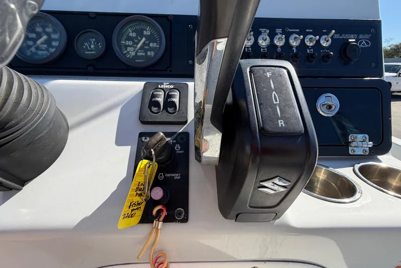Slide: The Image of 2020 Blazer Bay 2200 Fisherman boat dashboard with controls and gauges. - 21