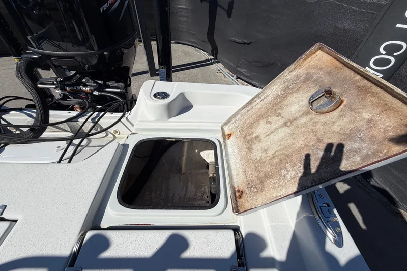 Slide: The Image of Open hatch on 2020 Blazer Bay 2200 Fisherman boat, revealing storage compartment. - 64