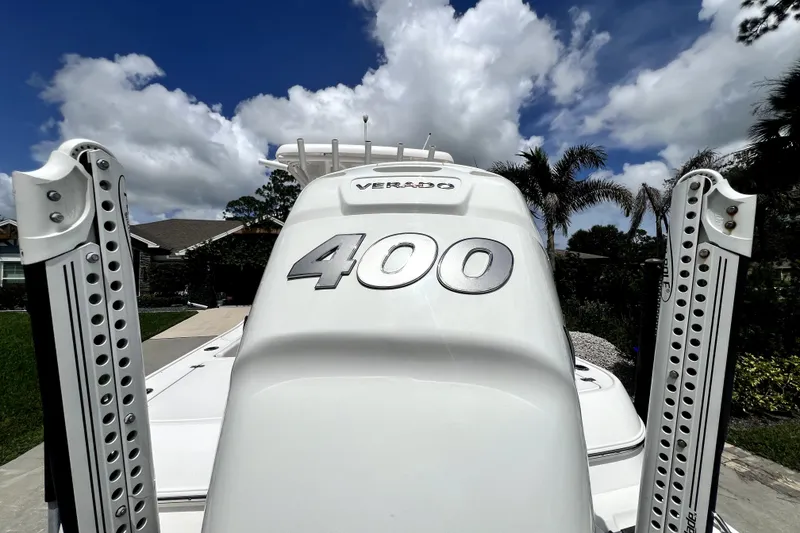 Slide: The Image of 2020 Caymas 26 HB boat with Verado 400 engine, under a partly cloudy sky. - 11