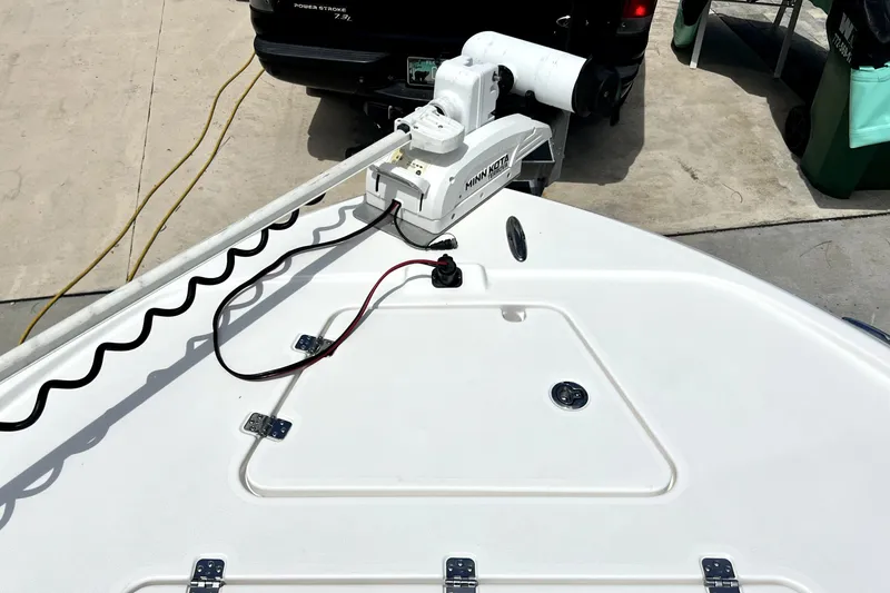 Slide: The Image of 2020 Caymas 26 HB boat with Minn Kota trolling motor on deck. - 60