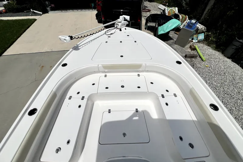 Slide: The Image of 2020 Caymas 26 HB boat deck with storage compartments and trolling motor. - 69