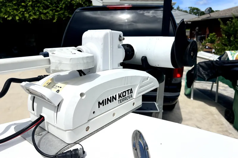 Slide: The Image of Minn Kota Terrova trolling motor on 2020 Caymas 26 HB boat, parked outdoors. - 66