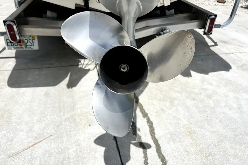 Slide: The Image of Propeller of a 2020 Caymas 26 HB boat on a trailer. - 12