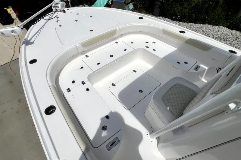 Slide: The Image of 2020 Caymas 26 HB boat deck with storage compartments and seating. - 53