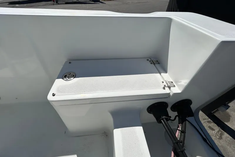 Slide: The Image of 2020 Clearwater 2000 Center Console boat storage compartment with secure latch and clean design. - 94