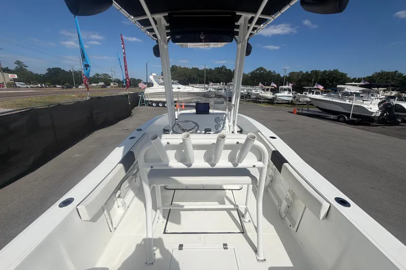 Slide: The Image of 2020 Clearwater 2000 Center Console boat at a dealership, showcasing interior and helm. - 25