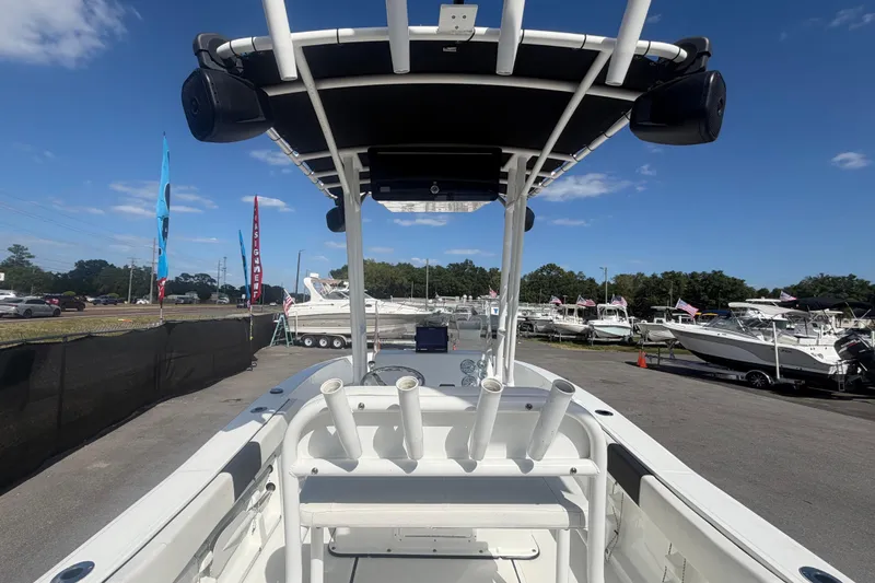 Slide: The Image of 2020 Clearwater 2000 Center Console boat at a dealership under clear blue skies. - 27