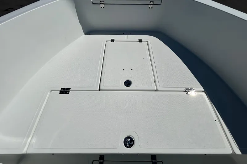 Slide: The Image of 2020 Clearwater 2000 Center Console boat deck with storage compartments. - 53