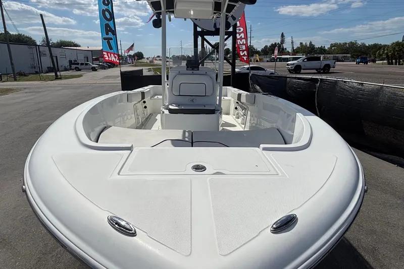 Slide: The Image of 2020 Clearwater 2000 Center Console boat displayed outdoors, showcasing spacious deck and seating. - 18