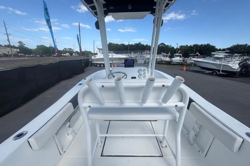 Slide: The Image of 2020 Clearwater 2000 Center Console boat interior with rod holders and dashboard view. - 28