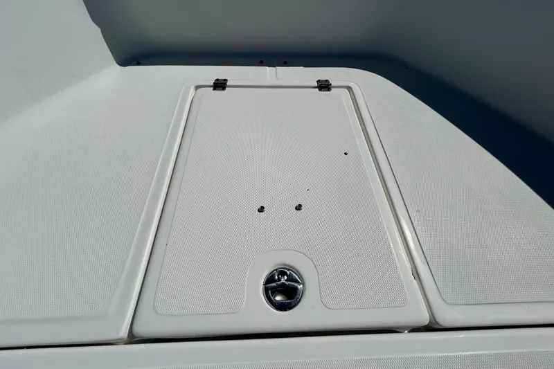 Slide: The Image of 2020 Clearwater 2000 Center Console boat deck with storage hatch. - 56