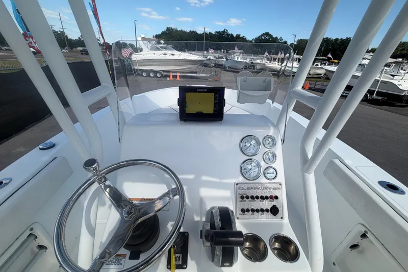 Slide: The Image of Clearwater 2000 Center Console boat dashboard with steering wheel and gauges, 2020 model. - 33
