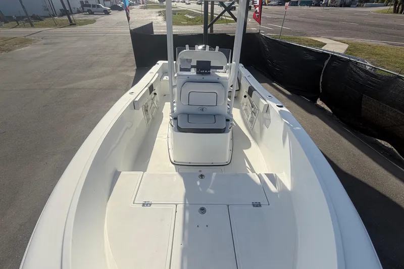 Slide: The Image of 2020 Clearwater 2000 Center Console boat, spacious deck, parked outdoors. - 64