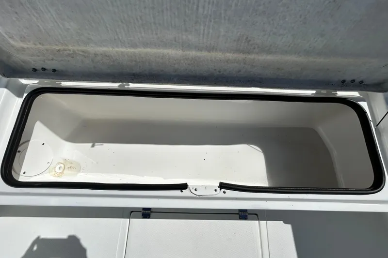 Slide: The Image of Open storage compartment on 2020 Clearwater 2000 Center Console boat. - 55
