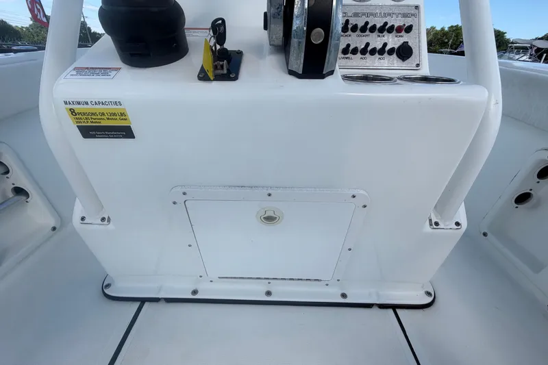 Slide: The Image of Clearwater 2000 Center Console 2020 boat dashboard with controls and capacity label. - 40
