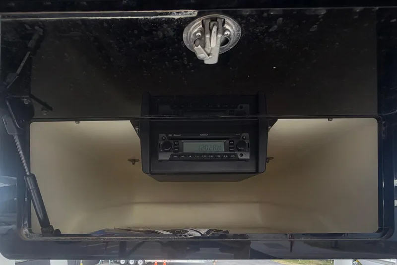 Slide: The Image of 2020 Clearwater 2000 Center Console boat dashboard with stereo system. - 36