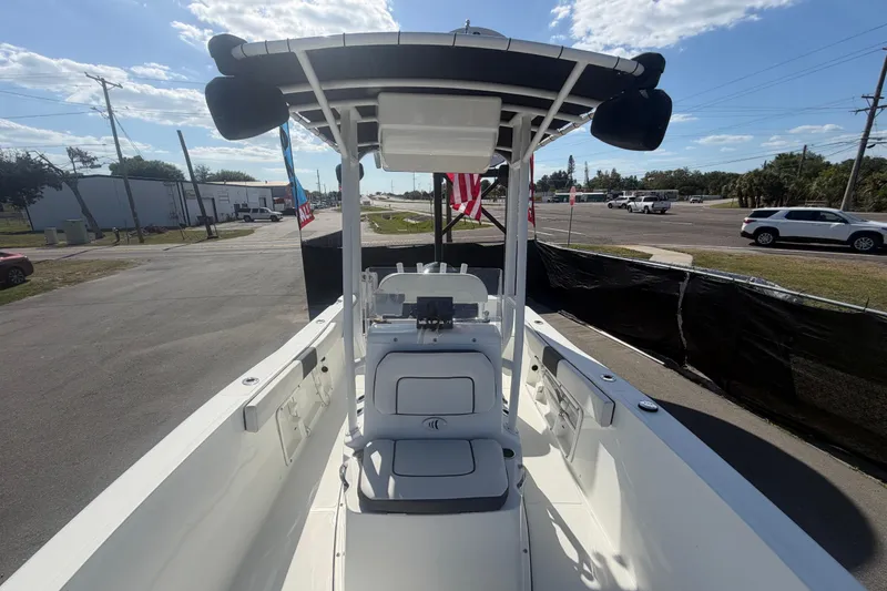 Slide: The Image of 2020 Clearwater 2000 Center Console boat with T-top, parked on a sunny day. - 68