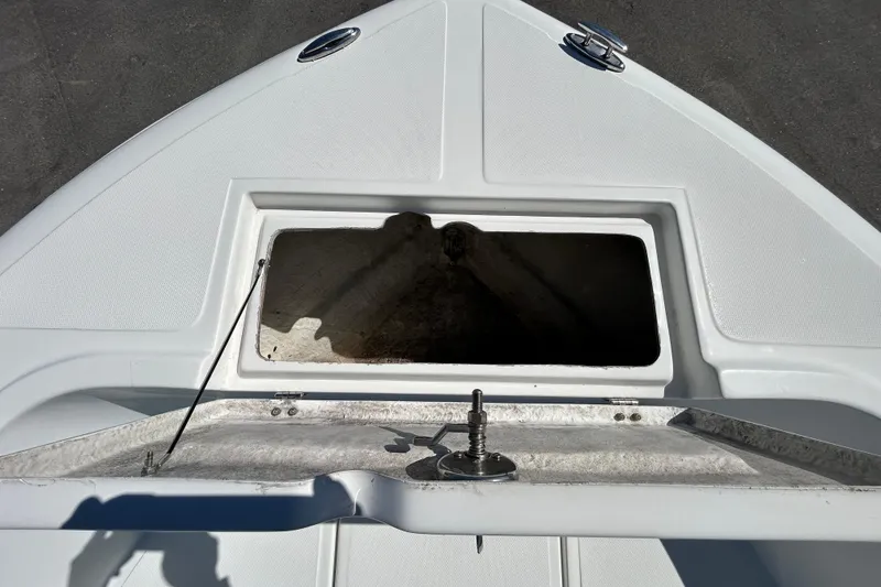 Slide: The Image of 2020 Clearwater 2000 Center Console boat deck with open storage compartment. - 61