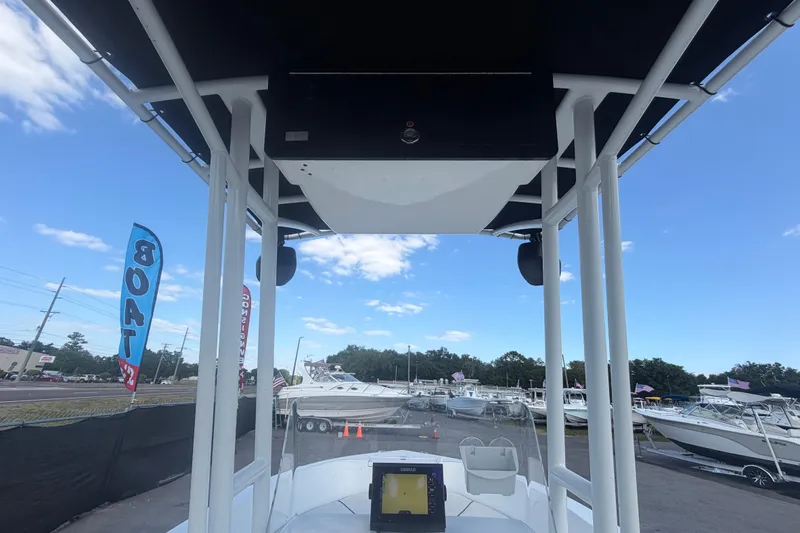 Slide: The Image of 2020 Clearwater 2000 Center Console boat at a dealership with blue sky background. - 35