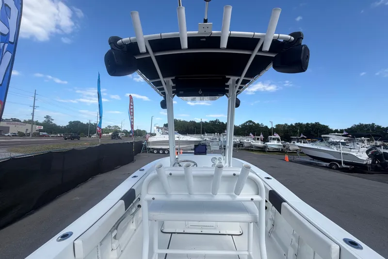 Slide: The Image of 2020 Clearwater 2000 Center Console boat at a marina under a clear blue sky. - 26