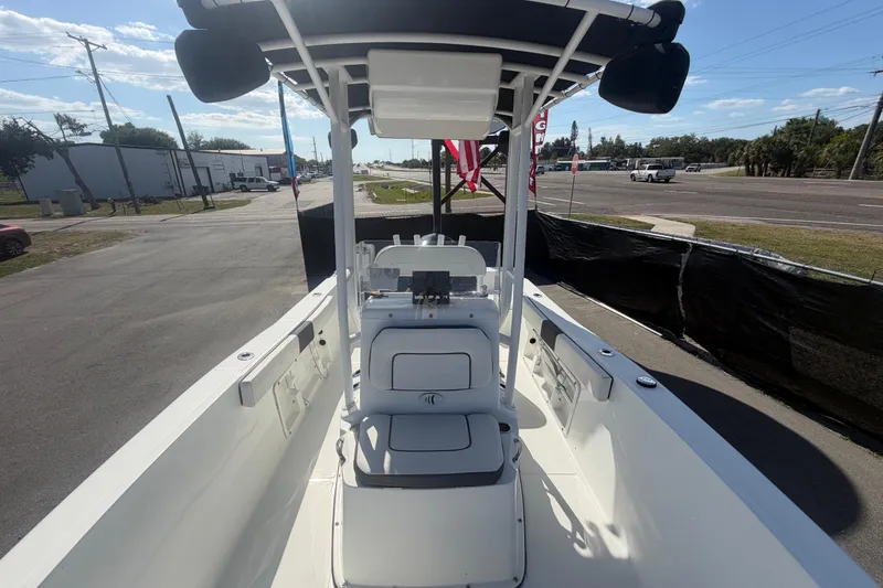 Slide: The Image of 2020 Clearwater 2000 Center Console boat, white interior, parked on a sunny day. - 69