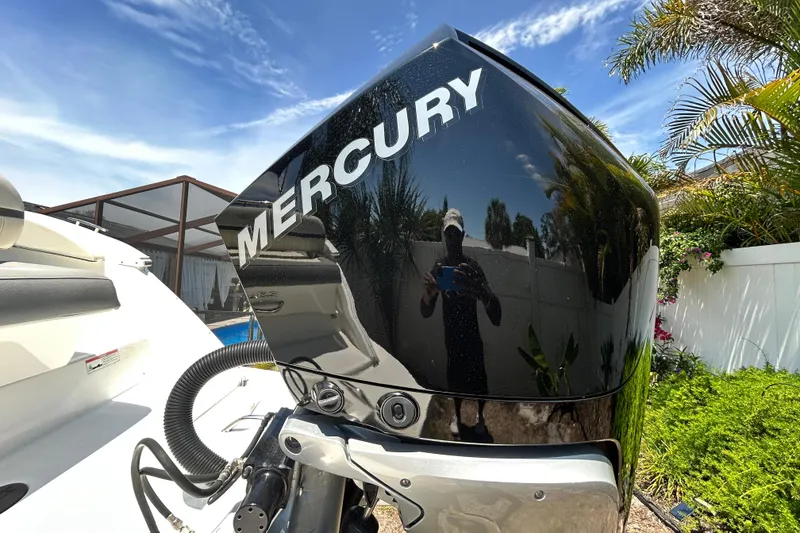 Slide: The Image of 2020 Cobalt 23SC boat with Mercury engine, outdoor setting, sunny day. - 9