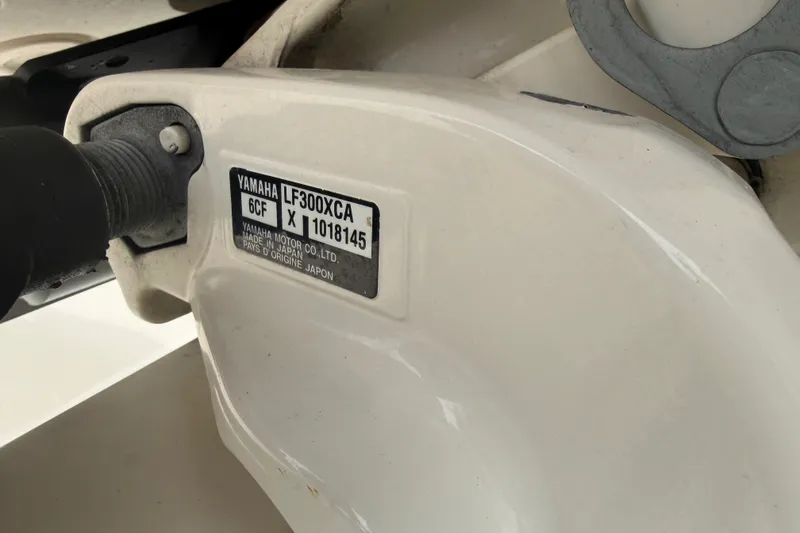 Slide: The Image of Close-up of Yamaha LF300XCA engine label on 2020 Cobia 301 Center Console boat. - 38