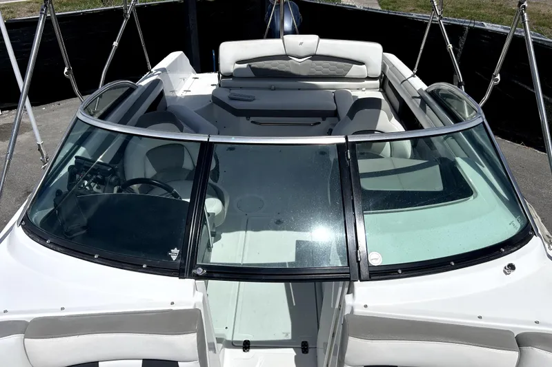 Slide: The Image of 2020 Four Winns HD220 boat interior with seating and windshield view. - 44