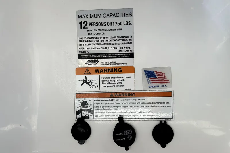 Slide: The Image of Warning labels on 2020 Four Winns HD220 boat, indicating capacity and safety information. - 69