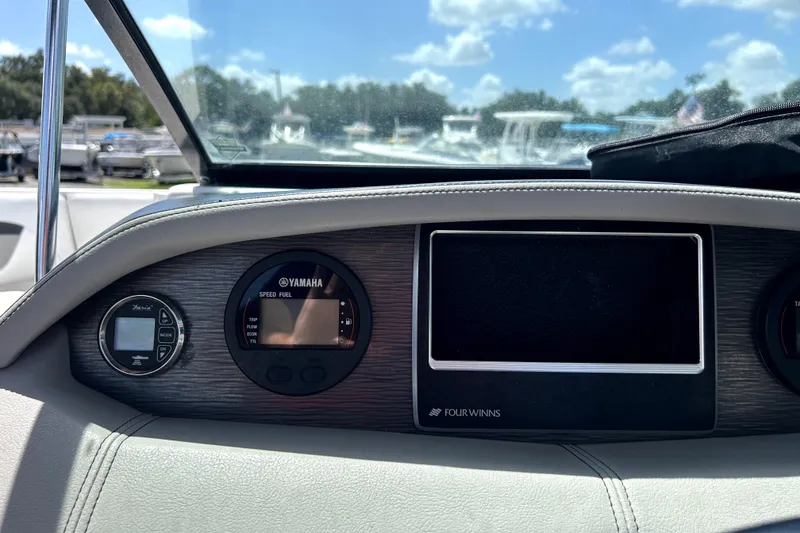 Slide: The Image of Dashboard of 2020 Four Winns HD220 boat with Yamaha speed and fuel gauges. - 21