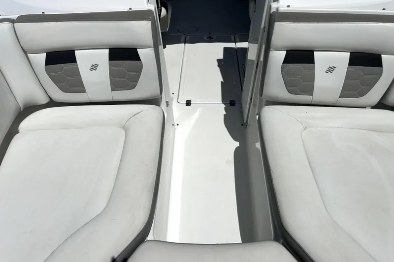 Slide: The Image of 2020 Four Winns HD220 boat interior with white cushioned seating and sleek design. - 36