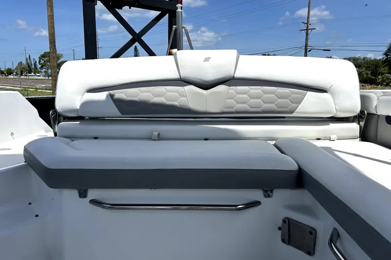 Slide: The Image of 2020 Four Winns HD220 boat interior with cushioned seating and sleek design. - 47
