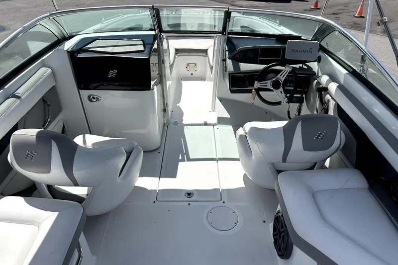 Slide: The Image of Interior of 2020 Four Winns HD220 boat with modern seating and Garmin navigation system. - 15