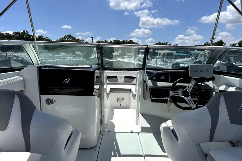 Slide: The Image of Interior view of 2020 Four Winns HD220 boat with Garmin navigation system. - 17
