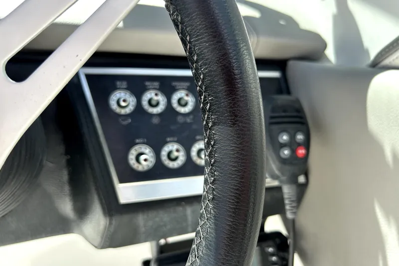 Slide: The Image of Steering wheel and control panel of 2020 Four Winns HD220 boat. - 23