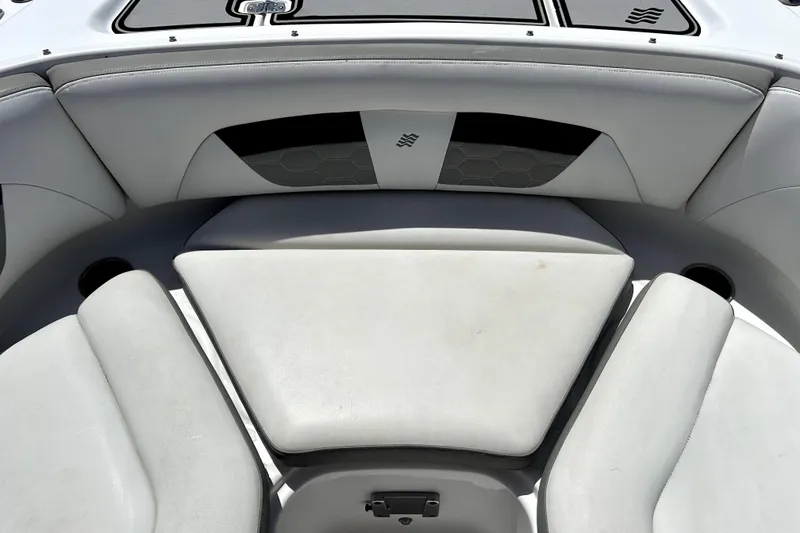 Slide: The Image of Interior seating of 2020 Four Winns HD220 boat, featuring white cushioned seats. - 34