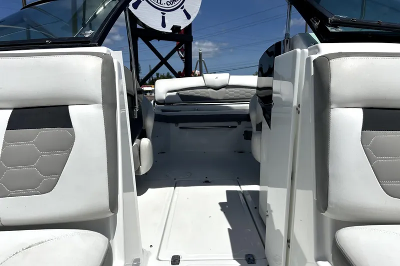 Slide: The Image of Interior view of 2020 Four Winns HD220 boat with white and gray seating. - 45