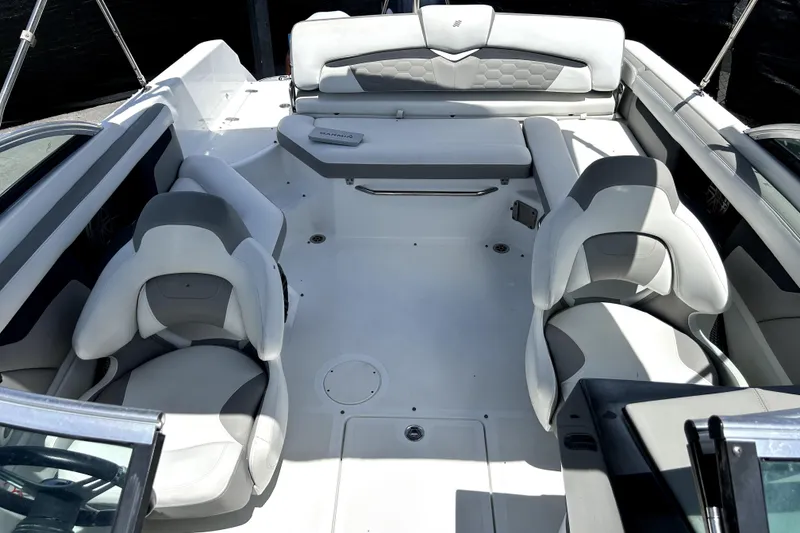 Slide: The Image of 2020 Four Winns HD220 boat interior with white and gray seating arrangement. - 46