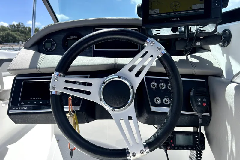 Slide: The Image of Steering wheel and dashboard of 2020 Four Winns HD220 boat with Garmin GPS. - 19