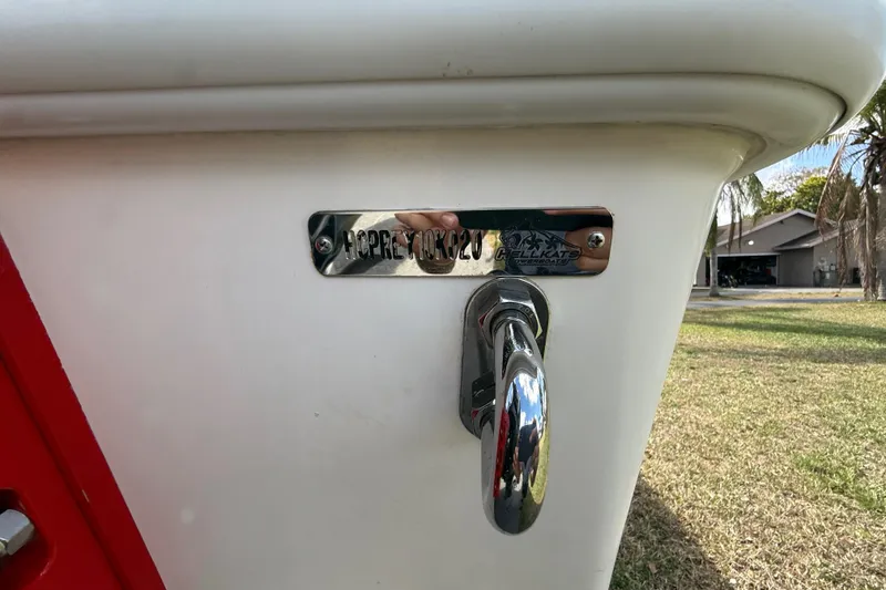 Slide: The Image of Close-up of a 2020 HellKats 30 boat with chrome hardware and nameplate. - 61