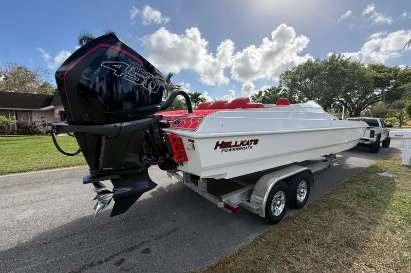Slide: The Image of 2020 HellKats 30 powerboat on trailer, featuring a powerful outboard engine. - 3