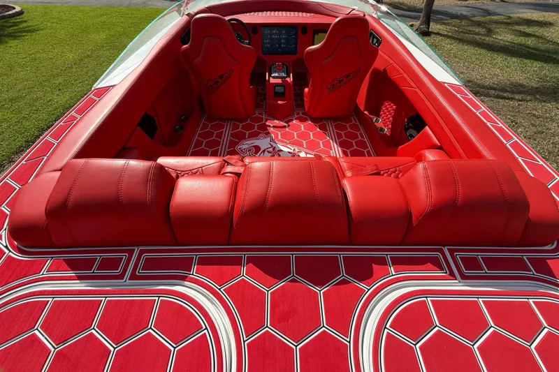 Slide: The Image of Red interior of 2020 HellKats 30 boat with hexagonal pattern and plush seating. - 20
